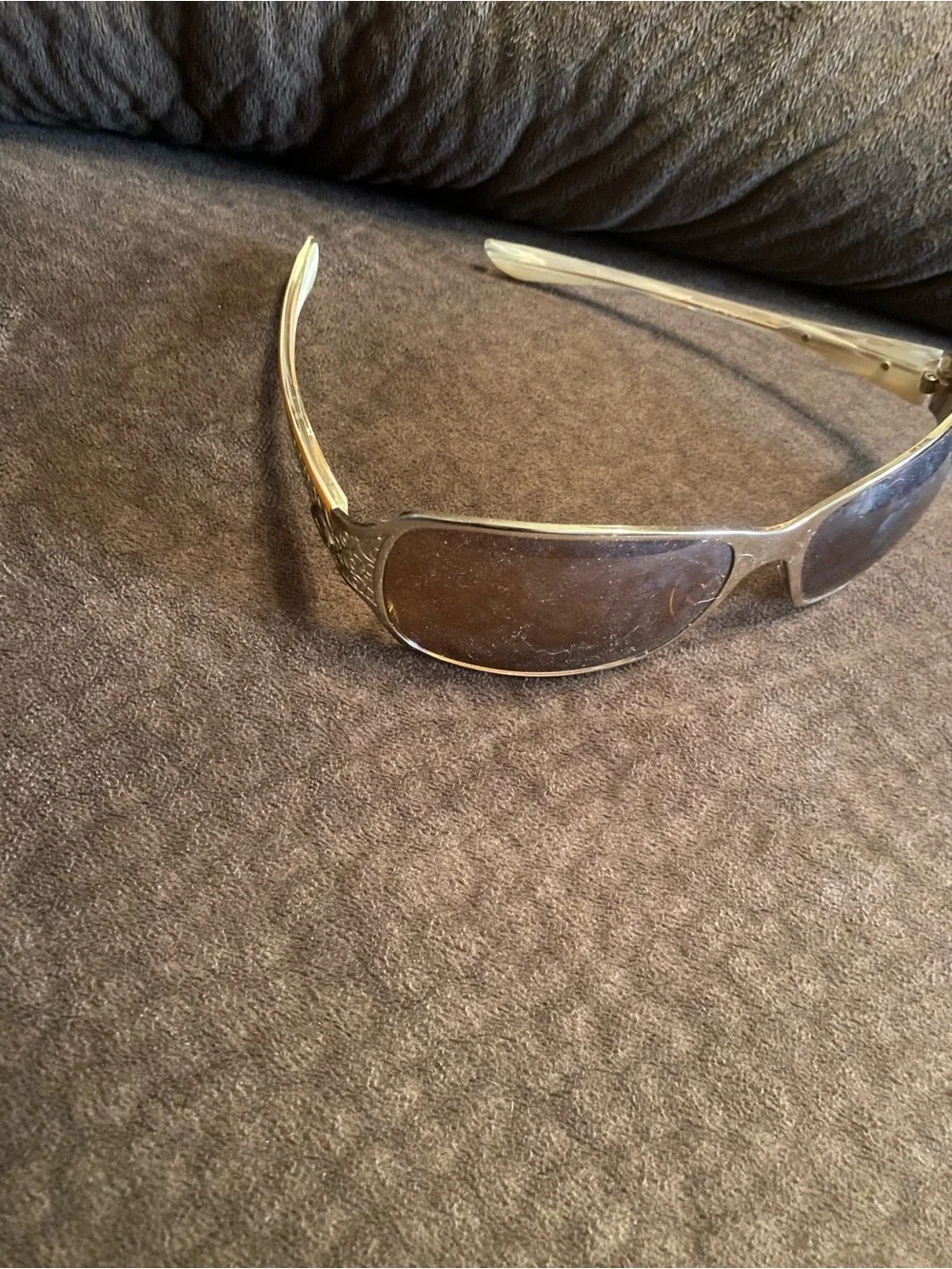 Oakley Silver Frame Sunglasses with Brown Lenses